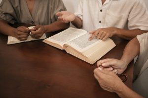 high-angle-people-praying-together